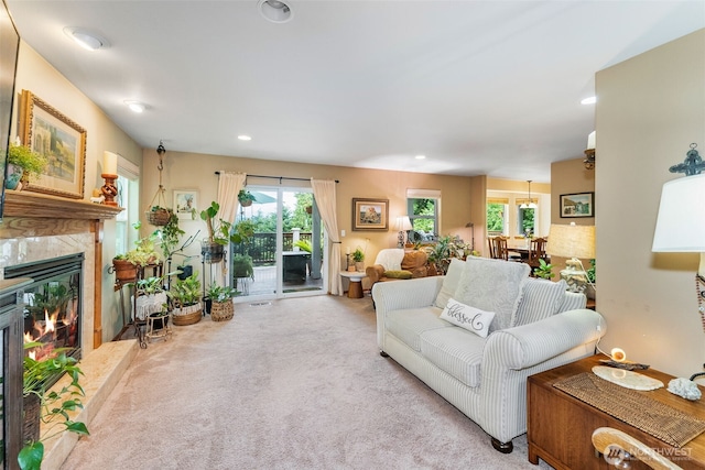 34059 Bridge View Dr NE, Kingston, WA 98346 - carpeted living room with healthy amount of natural light, a premium fireplace, and recessed lighting