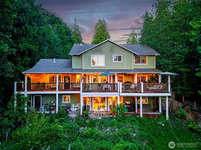 34059 Bridge View Dr NE, Kingston, WA 98346 - back of house with a patio, a deck, and a shingled roof