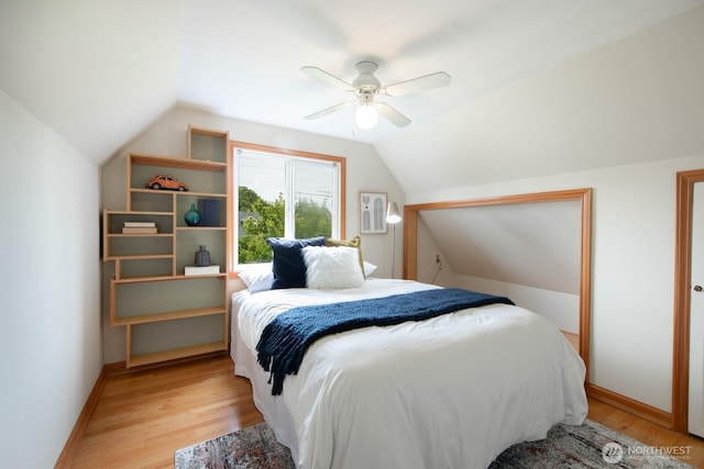 7310 10th Ave NW, Seattle, WA 98117 - bedroom with lofted ceiling, light wood-style floors, and a ceiling fan