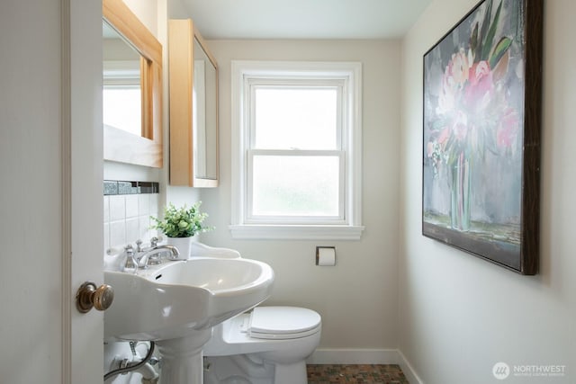 7310 10th Ave NW, Seattle, WA 98117 - half bathroom featuring baseboards and toilet
