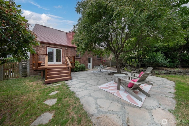 7310 10th Ave NW, Seattle, WA 98117 - view of patio / terrace featuring french doors and a deck