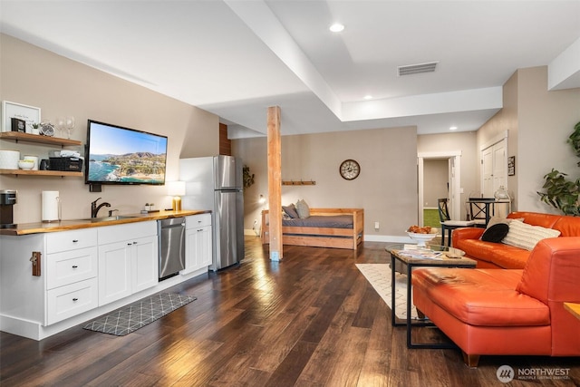 7235 20th Ave SE Unit A & B, Lacey, WA 98503 - living area featuring dark wood finished floors, recessed lighting, and bar with sink