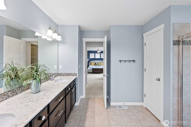 1897 Claret Loop NW, Poulsbo, WA 98370 - bathroom featuring ensuite bathroom, double vanity, tile patterned floors, and a tile shower