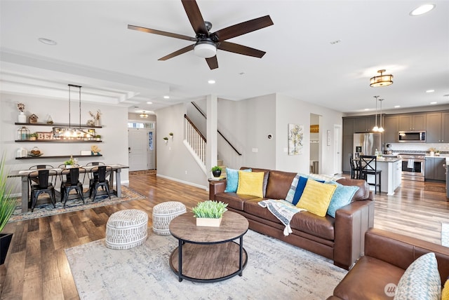 1897 Claret Loop NW, Poulsbo, WA 98370 - living room with ceiling fan, wood finished floors, recessed lighting, and stairs