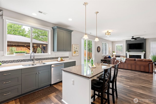 1897 Claret Loop NW, Poulsbo, WA 98370 - kitchen featuring stainless steel dishwasher, gray cabinetry, decorative backsplash, dark wood-style floors, and recessed lighting