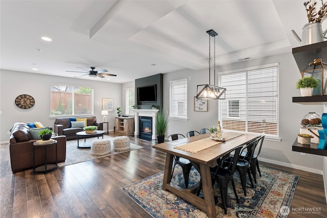 1897 Claret Loop NW, Poulsbo, WA 98370 - dining room with ceiling fan, wood finished floors, a warm lit fireplace, and recessed lighting