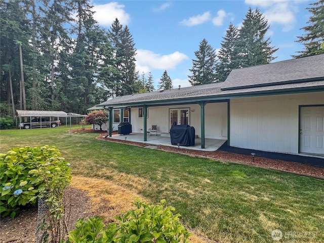 11411 208th Ave E, Bonney Lake, WA 98391 - rear view of property with a lawn and a patio
