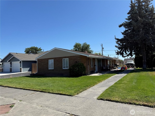 11311133 W Ivy Ave, Moses Lake, WA 98837 - single story home with a front yard, brick siding, a garage, and a porch
