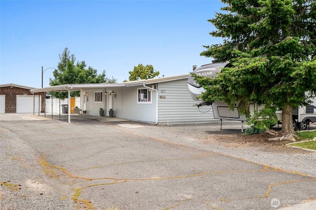407 Offut Dr, Moses Lake, WA 98837 - view of front of home featuring an outbuilding and a garage