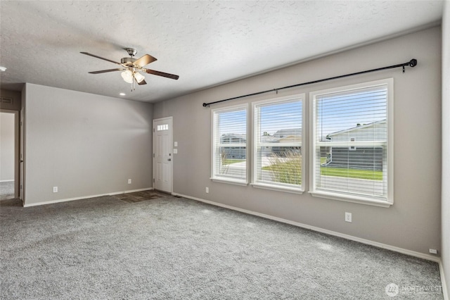 1701 E Burr Ave Unit 67, Moses Lake, WA 98837 - carpeted empty room featuring a ceiling fan and a textured ceiling