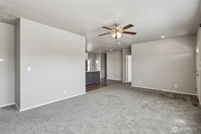 1701 E Burr Ave Unit 67, Moses Lake, WA 98837 - unfurnished living room with a ceiling fan, dark carpet, a textured ceiling, and recessed lighting