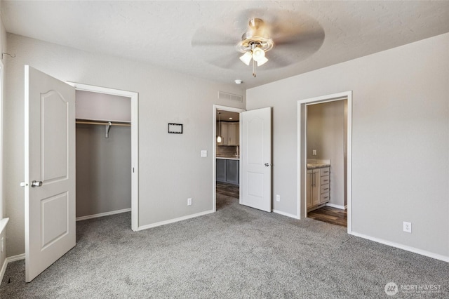 1701 E Burr Ave Unit 67, Moses Lake, WA 98837 - unfurnished bedroom with carpet, a closet, ensuite bath, and ceiling fan