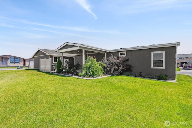 1701 E Burr Ave Unit 67, Moses Lake, WA 98837 - view of front of property with a front lawn and an attached garage