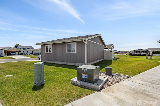 1701 E Burr Ave Unit 67, Moses Lake, WA 98837 - view of property exterior featuring a lawn