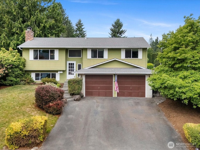 2613 172nd Pl SE, Bothell, WA 98012 - raised ranch with a chimney, a garage, driveway, a front lawn, and a shingled roof