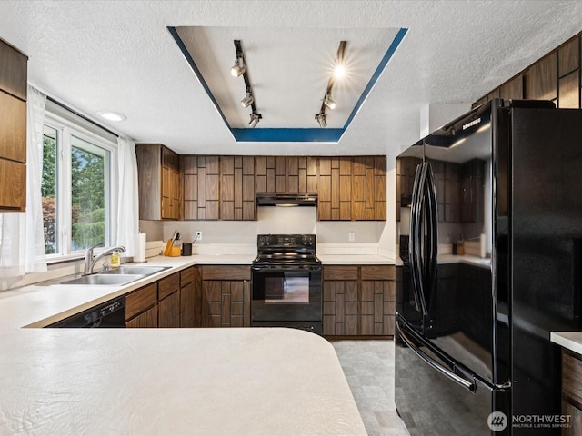2613 172nd Pl SE, Bothell, WA 98012 - kitchen with black appliances, under cabinet range hood, a textured ceiling, light countertops, and track lighting