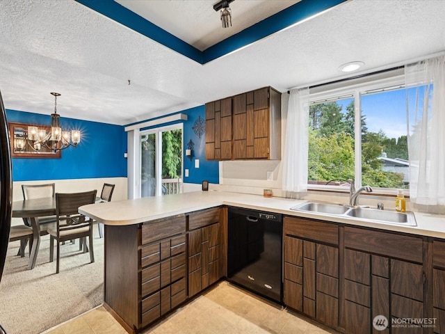 2613 172nd Pl SE, Bothell, WA 98012 - kitchen with dishwasher, a textured ceiling, a peninsula, light countertops, and a chandelier