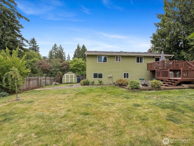 2613 172nd Pl SE, Bothell, WA 98012 - rear view of house with a storage shed, a wooden deck, and a chimney