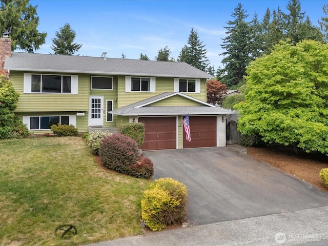 2613 172nd Pl SE, Bothell, WA 98012 - bi-level home featuring asphalt driveway, a chimney, and an attached garage