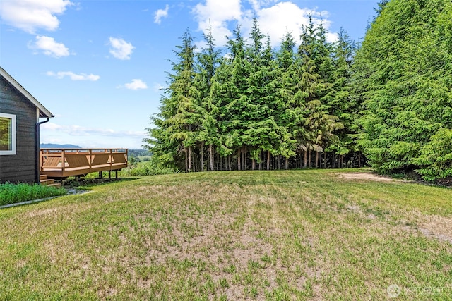 874 W State Route 4, Cathlamet, WA 98612 - view of grassy yard featuring a wooden deck and a view of trees