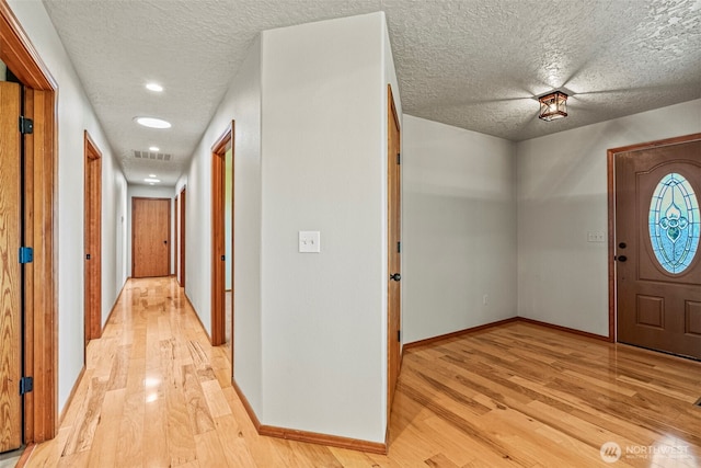 874 W State Route 4, Cathlamet, WA 98612 - foyer featuring light wood-type flooring, a textured ceiling, and recessed lighting