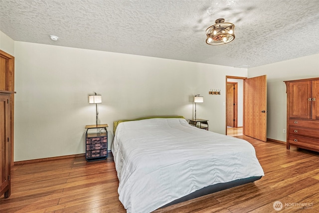 874 W State Route 4, Cathlamet, WA 98612 - bedroom with light wood-style floors and a textured ceiling