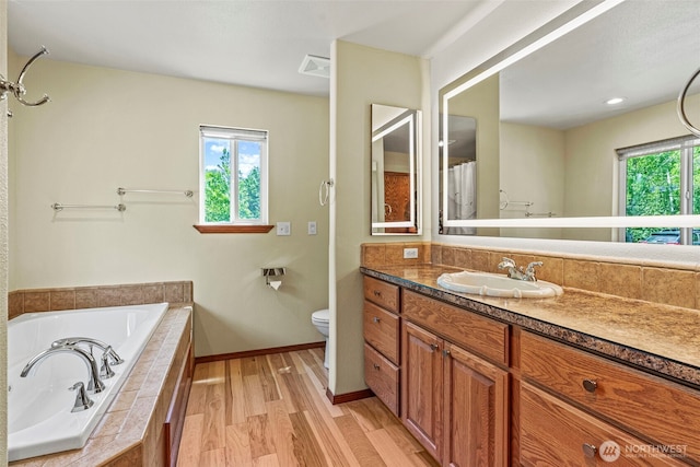 874 W State Route 4, Cathlamet, WA 98612 - bathroom with vanity, a bath, and wood finished floors