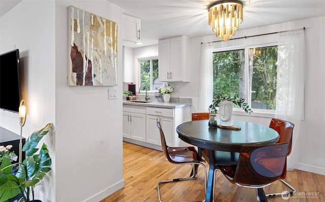 12629 SE 169th St, Renton, WA 98058 - dining room featuring light wood-type flooring and a chandelier