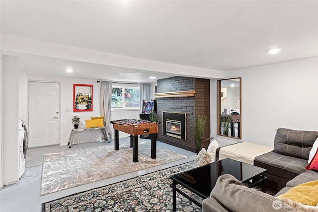 12629 SE 169th St, Renton, WA 98058 - living area with a brick fireplace, finished concrete flooring, and recessed lighting