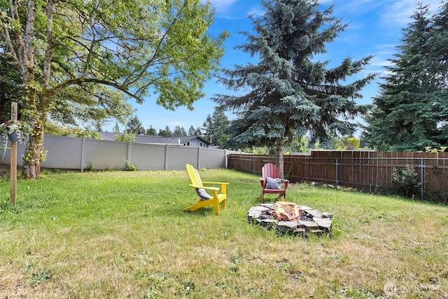 12629 SE 169th St, Renton, WA 98058 - fenced backyard featuring an outdoor fire pit