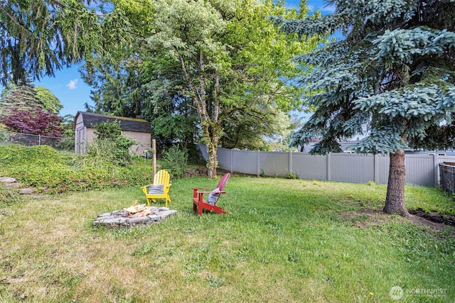 12629 SE 169th St, Renton, WA 98058 - fenced backyard featuring a storage shed and an outdoor fire pit