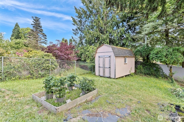 12629 SE 169th St, Renton, WA 98058 - fenced backyard with a vegetable garden and a storage unit