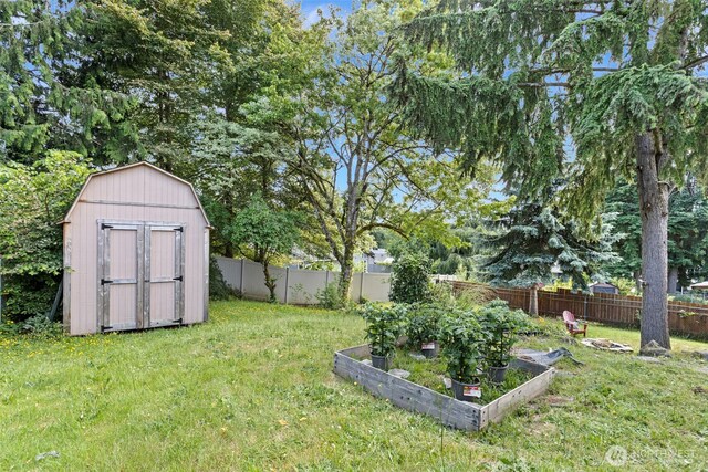 12629 SE 169th St, Renton, WA 98058 - fenced backyard with a storage shed and a vegetable garden