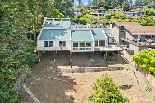 2838 170th Ave SE, Bellevue, WA 98008 - back of house with a fenced backyard, a metal roof, and a deck
