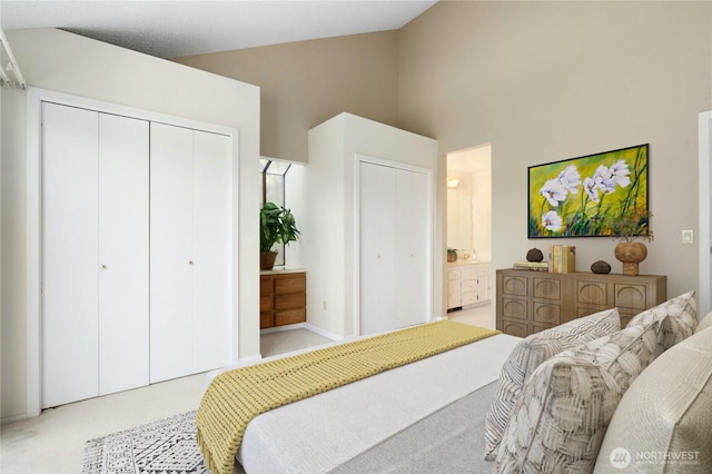 2838 170th Ave SE, Bellevue, WA 98008 - bedroom featuring high vaulted ceiling, light carpet, and ensuite bathroom