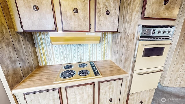 11453 Bayview Edison Rd Unit 25, Mount Vernon, WA 98273 - kitchen with under cabinet range hood, electric cooktop, light countertops, wallpapered walls, and double oven