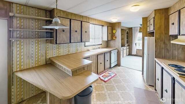 11453 Bayview Edison Rd Unit 25, Mount Vernon, WA 98273 - kitchen featuring white appliances, light floors, light countertops, open shelves, and range hood