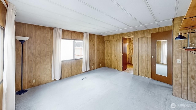 11453 Bayview Edison Rd Unit 25, Mount Vernon, WA 98273 - unfurnished bedroom featuring wooden walls and connected bathroom
