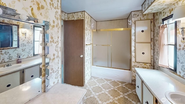 11453 Bayview Edison Rd Unit 25, Mount Vernon, WA 98273 - bathroom with wallpapered walls, healthy amount of natural light, vanity, and bath / shower combo with glass door
