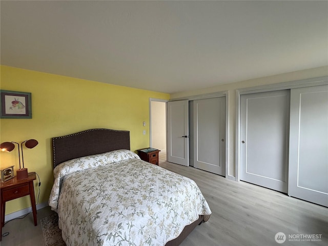 440 W Nelson Rd, Sequim, WA 98382 - bedroom featuring two closets and wood finished floors