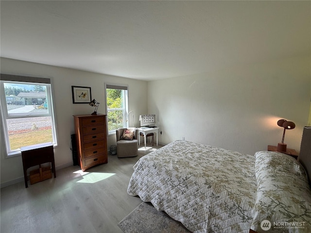 440 W Nelson Rd, Sequim, WA 98382 - bedroom featuring wood finished floors and baseboards