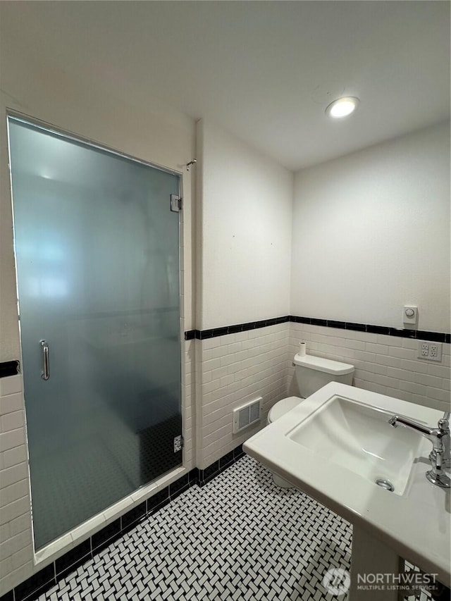 8329 20th St SE, Lake Stevens, WA 98258 - full bath featuring tile walls, a wainscoted wall, a shower stall, and recessed lighting