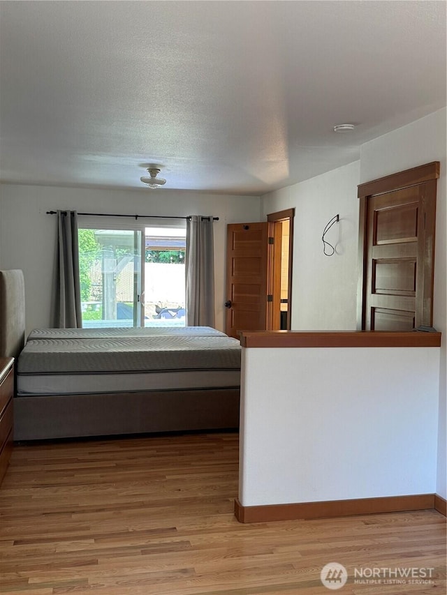 8329 20th St SE, Lake Stevens, WA 98258 - bedroom featuring light wood-type flooring and baseboards