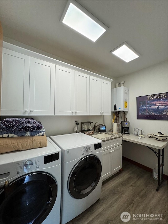 8329 20th St SE, Lake Stevens, WA 98258 - laundry room featuring tankless water heater, washer and clothes dryer, dark wood finished floors, and cabinet space