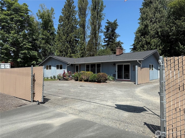 8329 20th St SE, Lake Stevens, WA 98258 - ranch-style home with a chimney and asphalt driveway