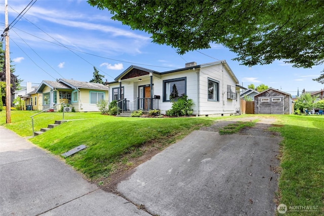 2304 F St, Bellingham, WA 98225 - ranch-style house featuring an outbuilding, crawl space, a front yard, and asphalt driveway