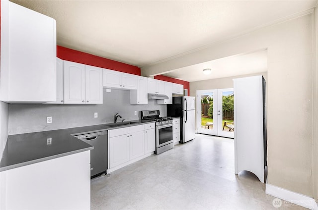 2304 F St, Bellingham, WA 98225 - kitchen featuring stainless steel appliances, white cabinets, french doors, under cabinet range hood, and light flooring