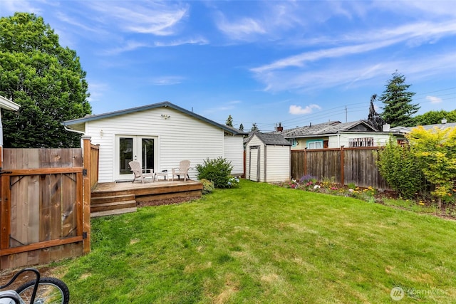 2304 F St, Bellingham, WA 98225 - back of house featuring a wooden deck, a fenced backyard, a storage unit, and french doors