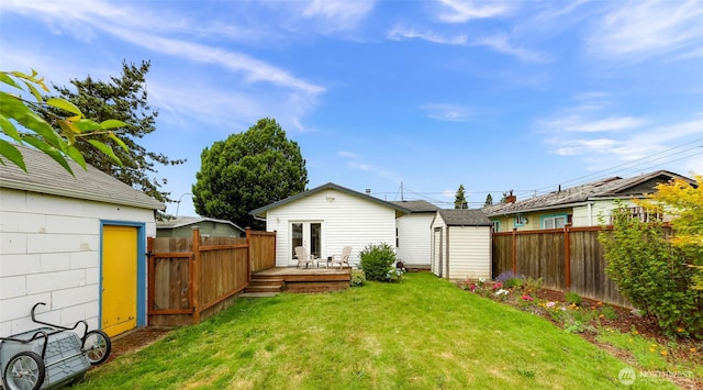 2304 F St, Bellingham, WA 98225 - rear view of house with a storage shed, a deck, and a fenced backyard