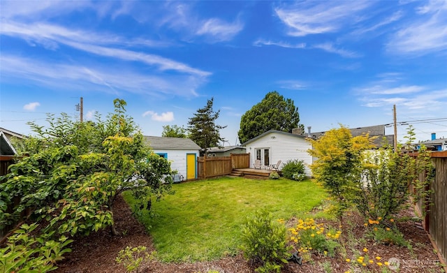 2304 F St, Bellingham, WA 98225 - fenced backyard featuring a deck and an outbuilding